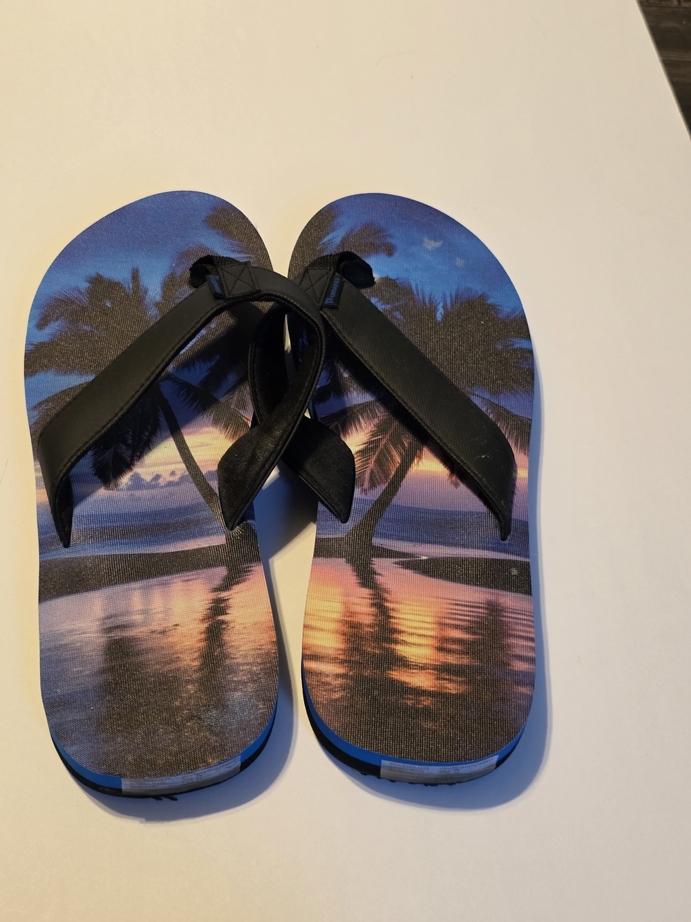 No Boundaries Men's Tropical Sunset Flip Flops - Black Straps, Blue/Purple Print